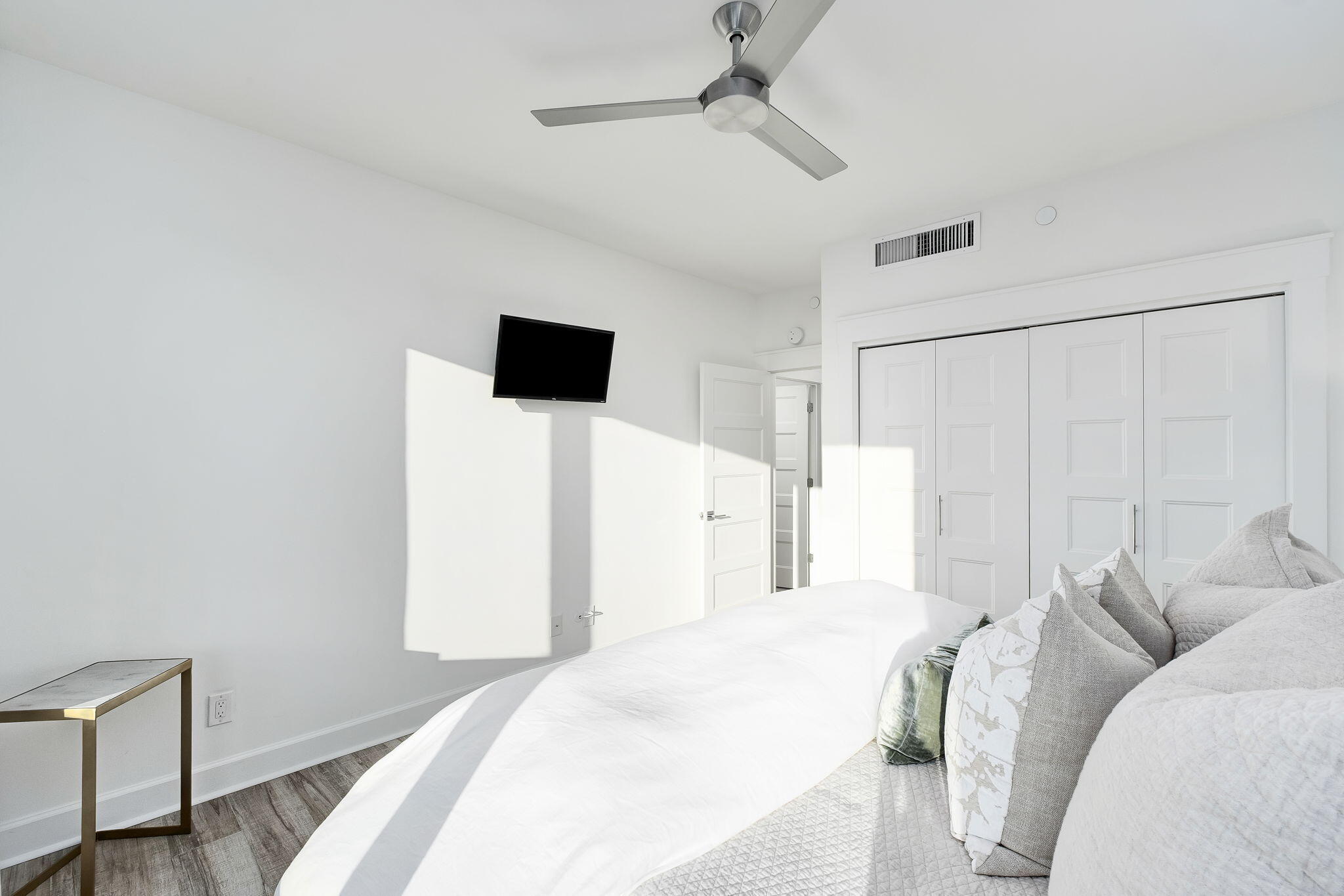 320 Harbor Boulevard, Unit A305 Destin, FL 32541 - Photo 34 of 71 a bedroom with a bed and a flat screen tv