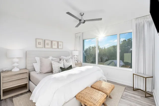 a view of a balcony with furniture and a floor to ceiling window