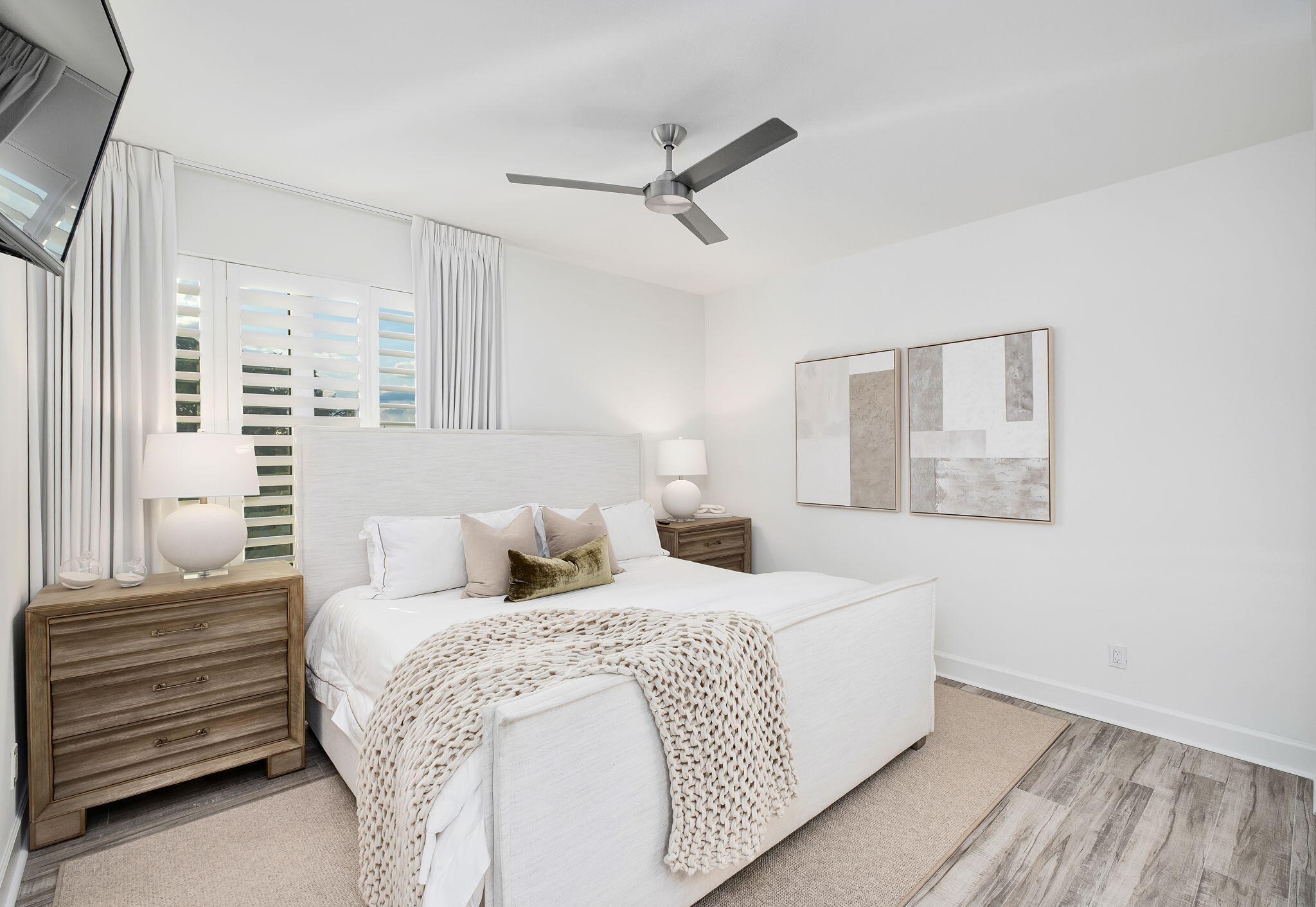 320 Harbor Boulevard, Unit A305 Destin, FL 32541 - Photo 37 of 71 a bedroom with a bed and a ceiling fan