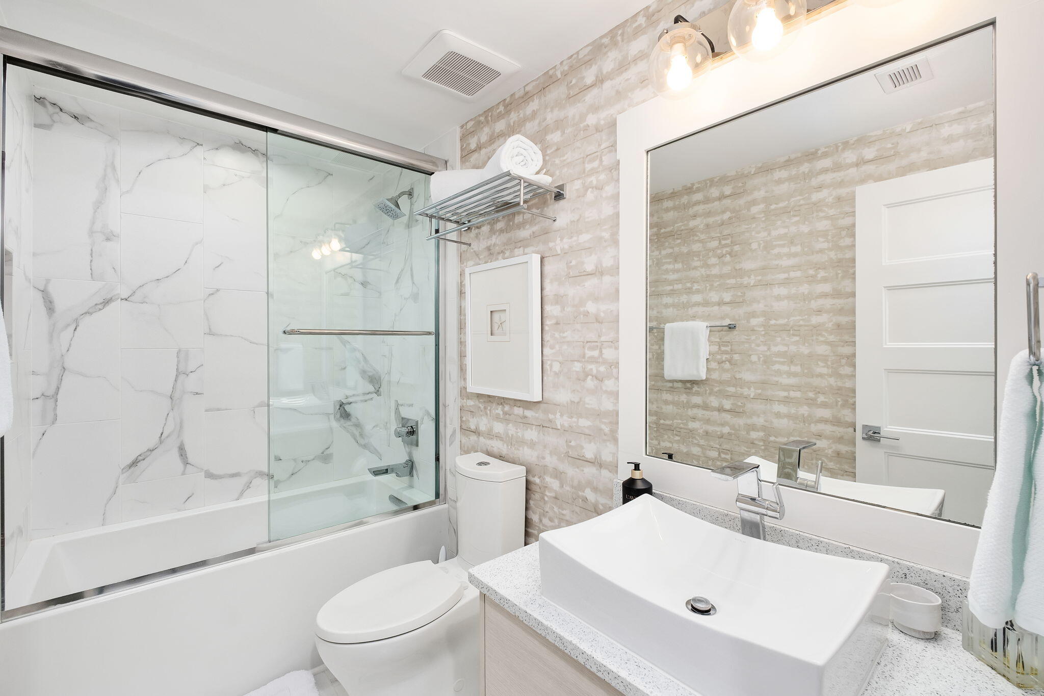 320 Harbor Boulevard, Unit A305 Destin, FL 32541 - Photo 39 of 71 a bathroom with a sink toilet and shower