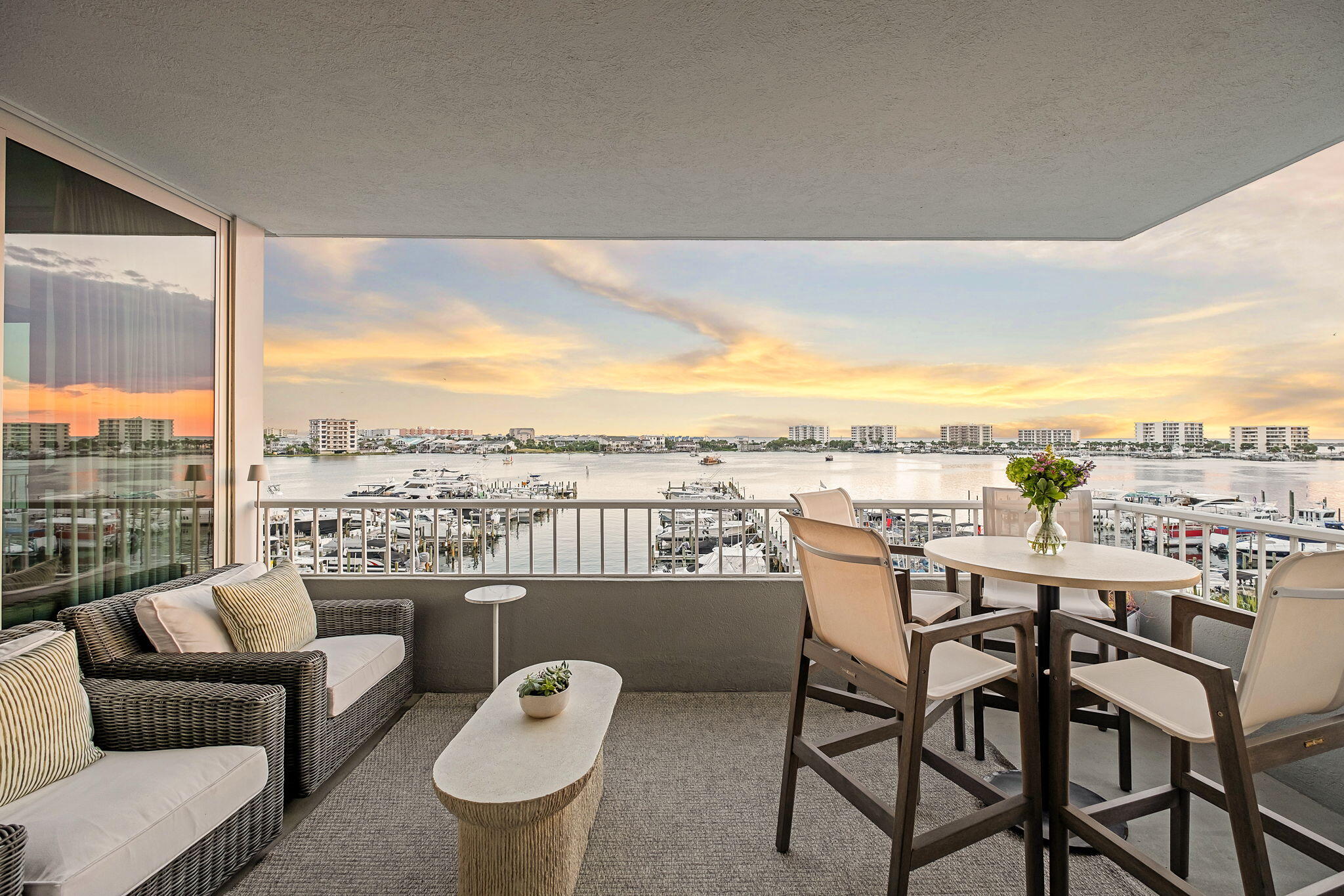 320 Harbor Boulevard, Unit A305 Destin, FL 32541 - Photo 40 of 71 a view of a balcony with furniture and a floor to ceiling window