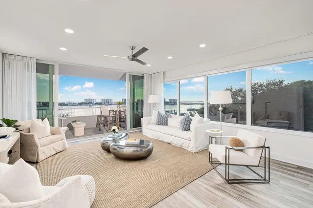 a view of a chairs and table in the balcony