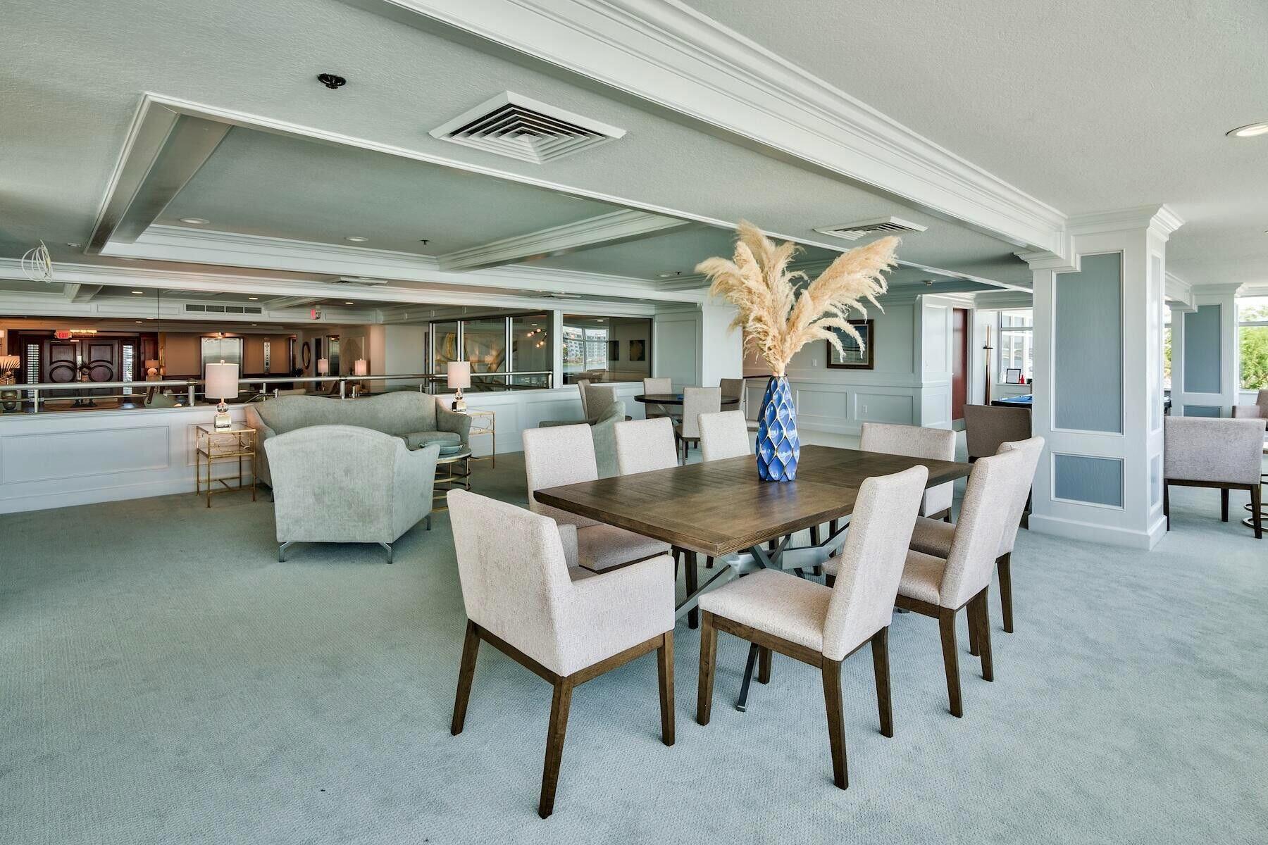 320 Harbor Boulevard, Unit A305 Destin, FL 32541 - Photo 56 of 71 a dining room with furniture and wooden floor
