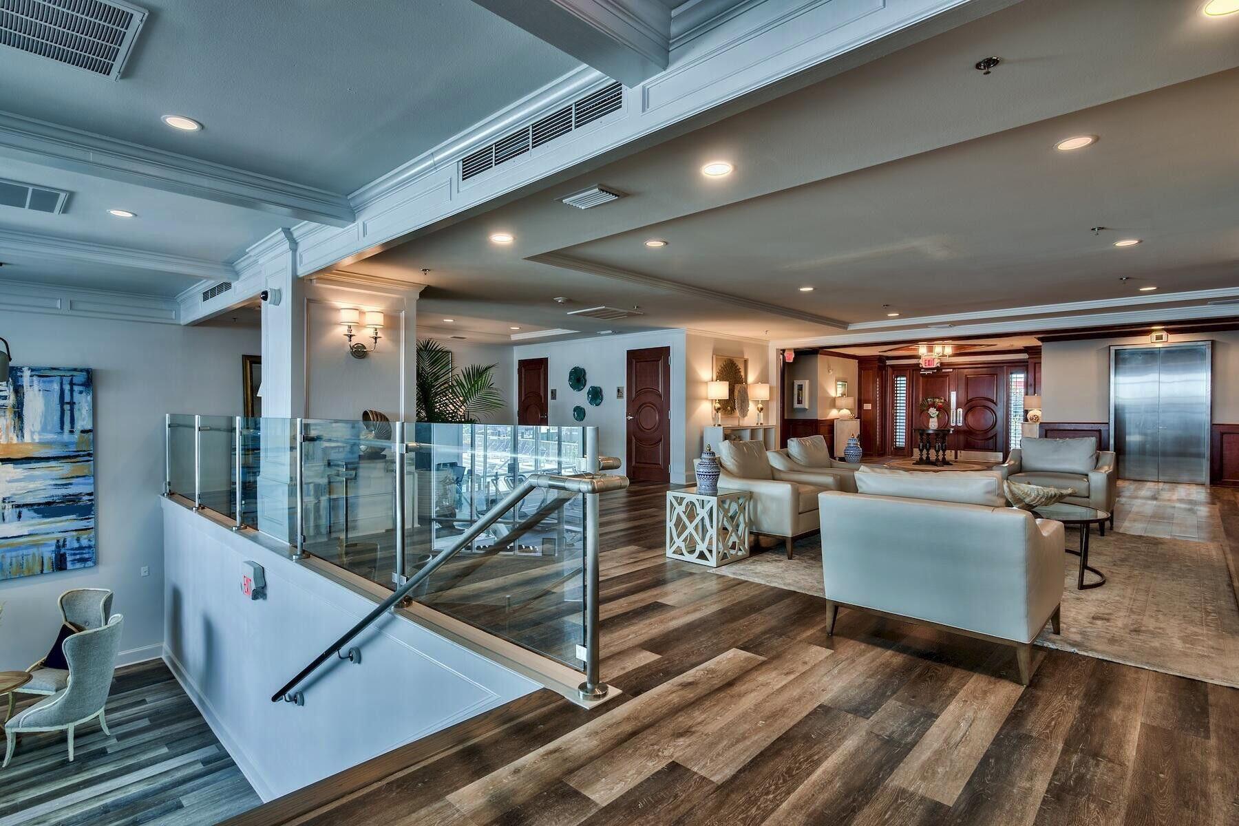 320 Harbor Boulevard, Unit A305 Destin, FL 32541 - Photo 57 of 71 a room with lots of wooden furniture and view of living room