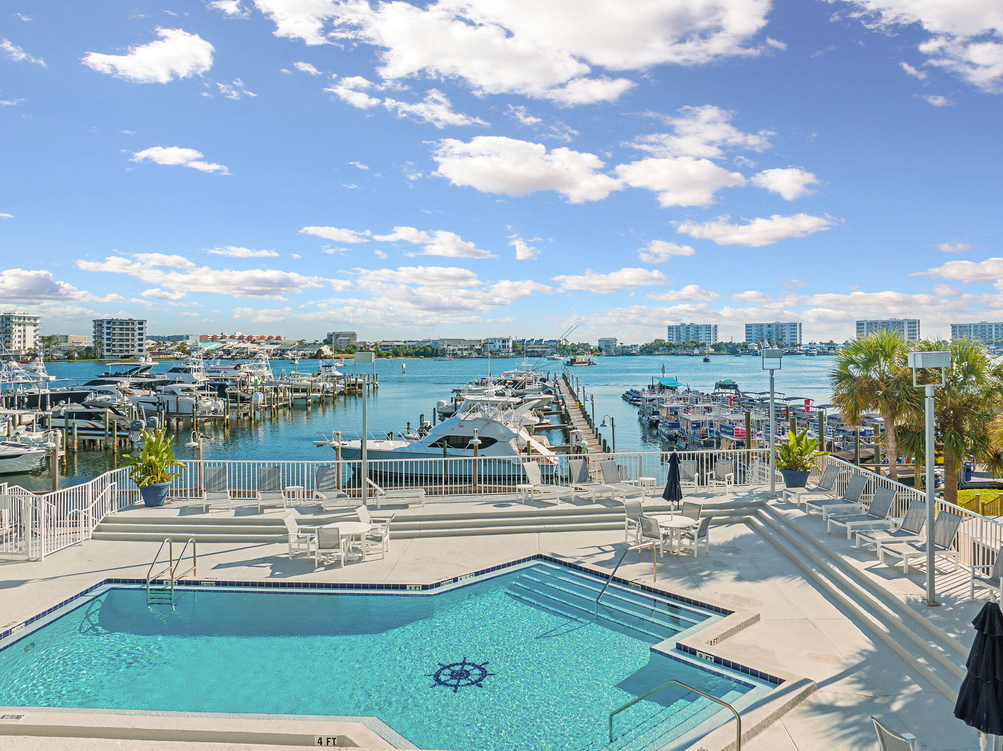 320 Harbor Boulevard, Unit A305 Destin, FL 32541 - Photo 59 of 71 a view of a swimming pool with an outdoor seating