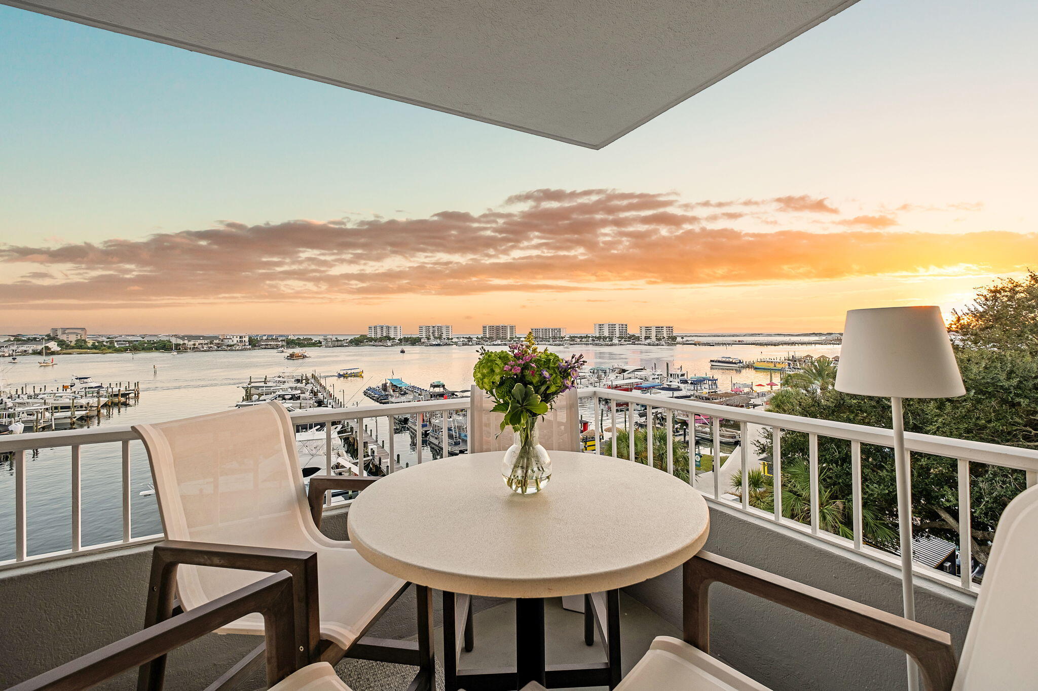 320 Harbor Boulevard, Unit A305 Destin, FL 32541 - Photo 8 of 71 a view of a chairs and table in the balcony