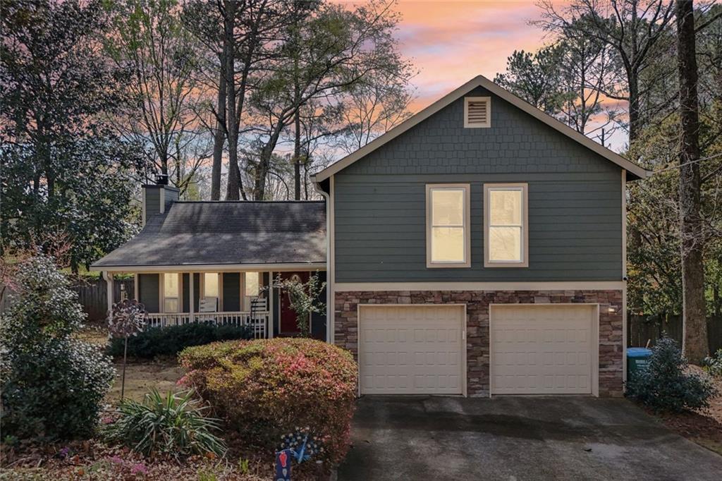 4128 Buckingham Place Duluth, GA 30096 - Photo 1 of 1 a front view of a house with a yard