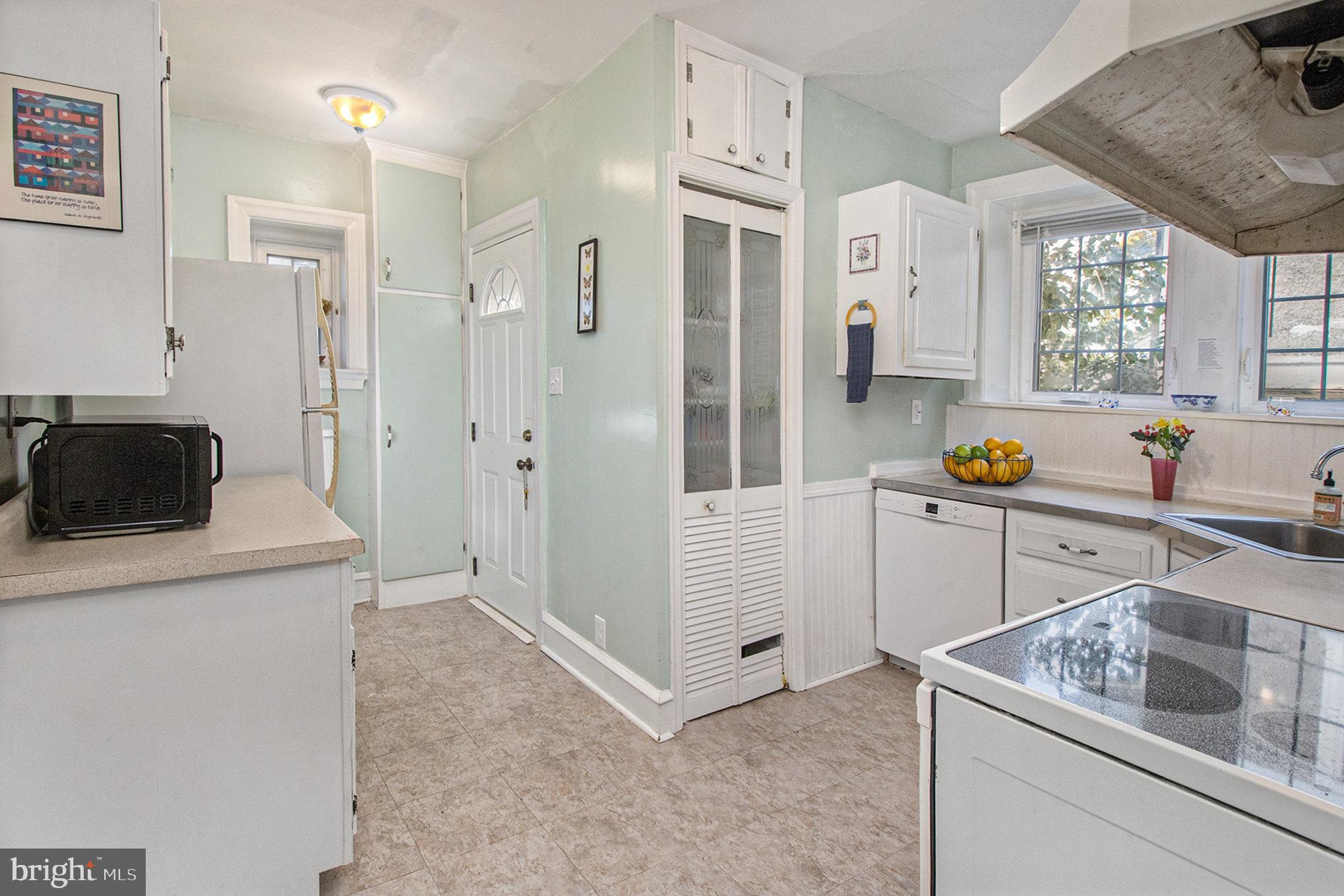 7115 Llanfair Road Upper Darby, PA 19082 - Photo 11 of 49 Kitchen with pantry and door to the deck.