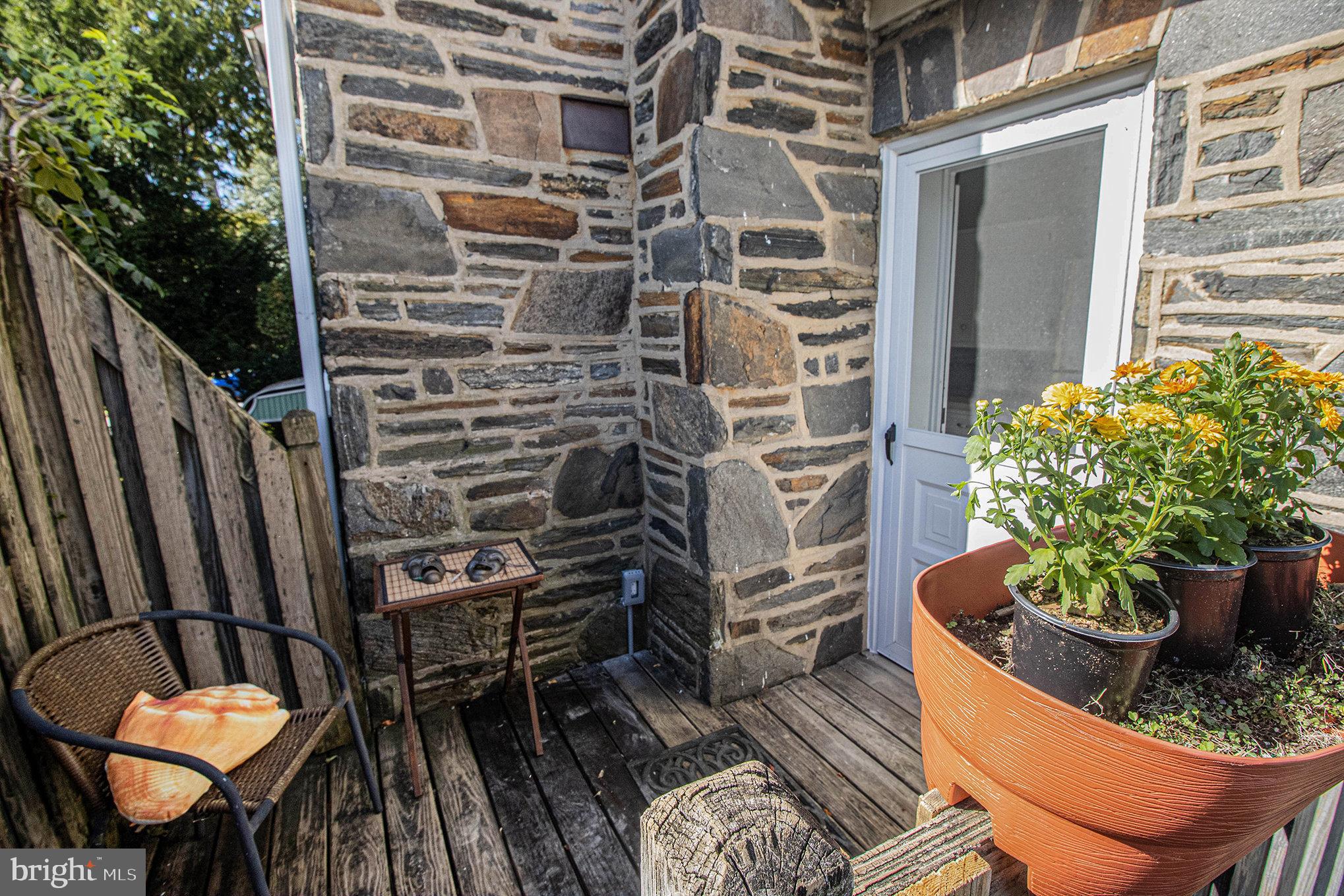 7115 Llanfair Road Upper Darby, PA 19082 - Photo 42 of 49 Rear deck with stairs to the yard.