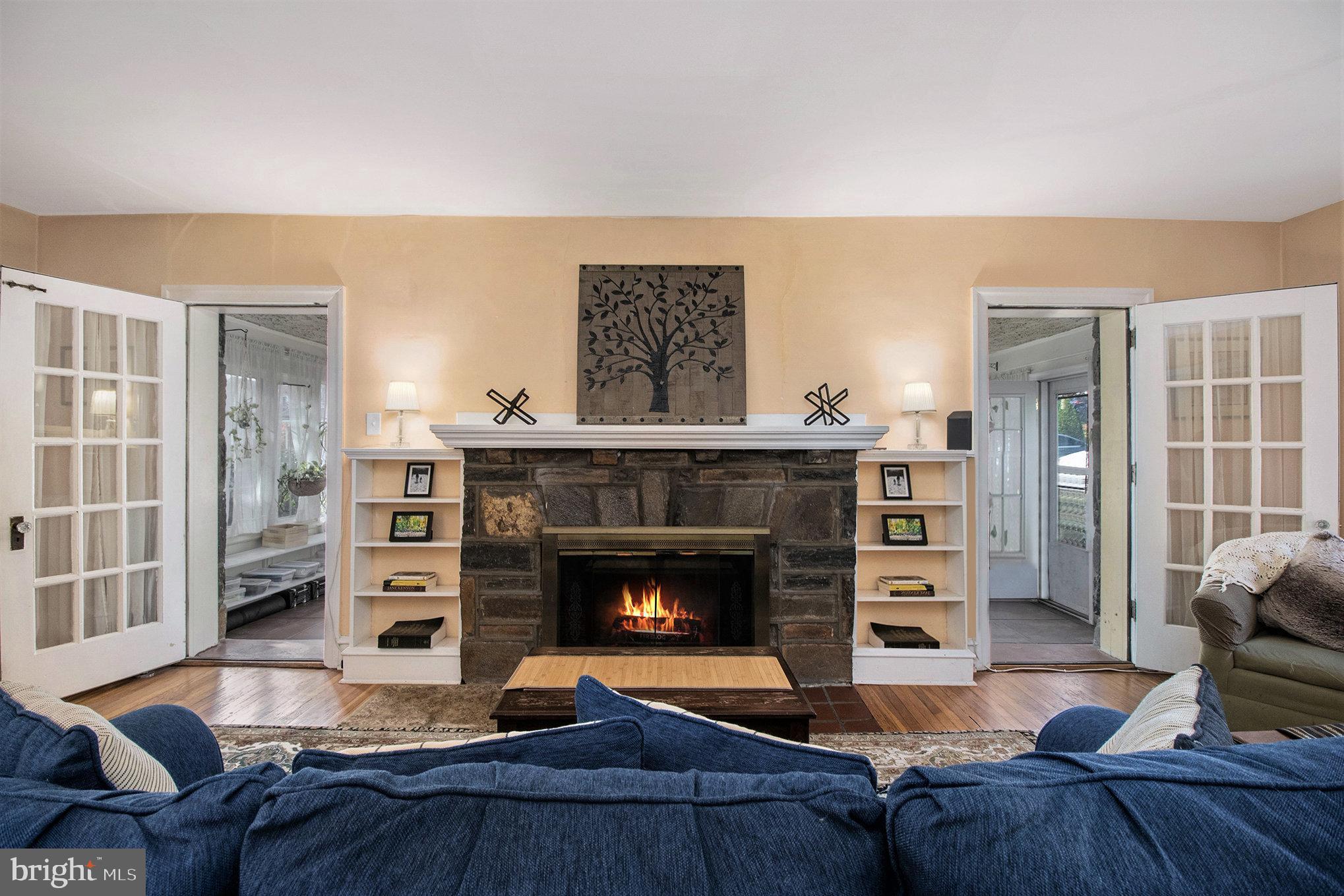 7115 Llanfair Road Upper Darby, PA 19082 - Photo 5 of 49 Cozy living room fireplace w/ built-in shelves.