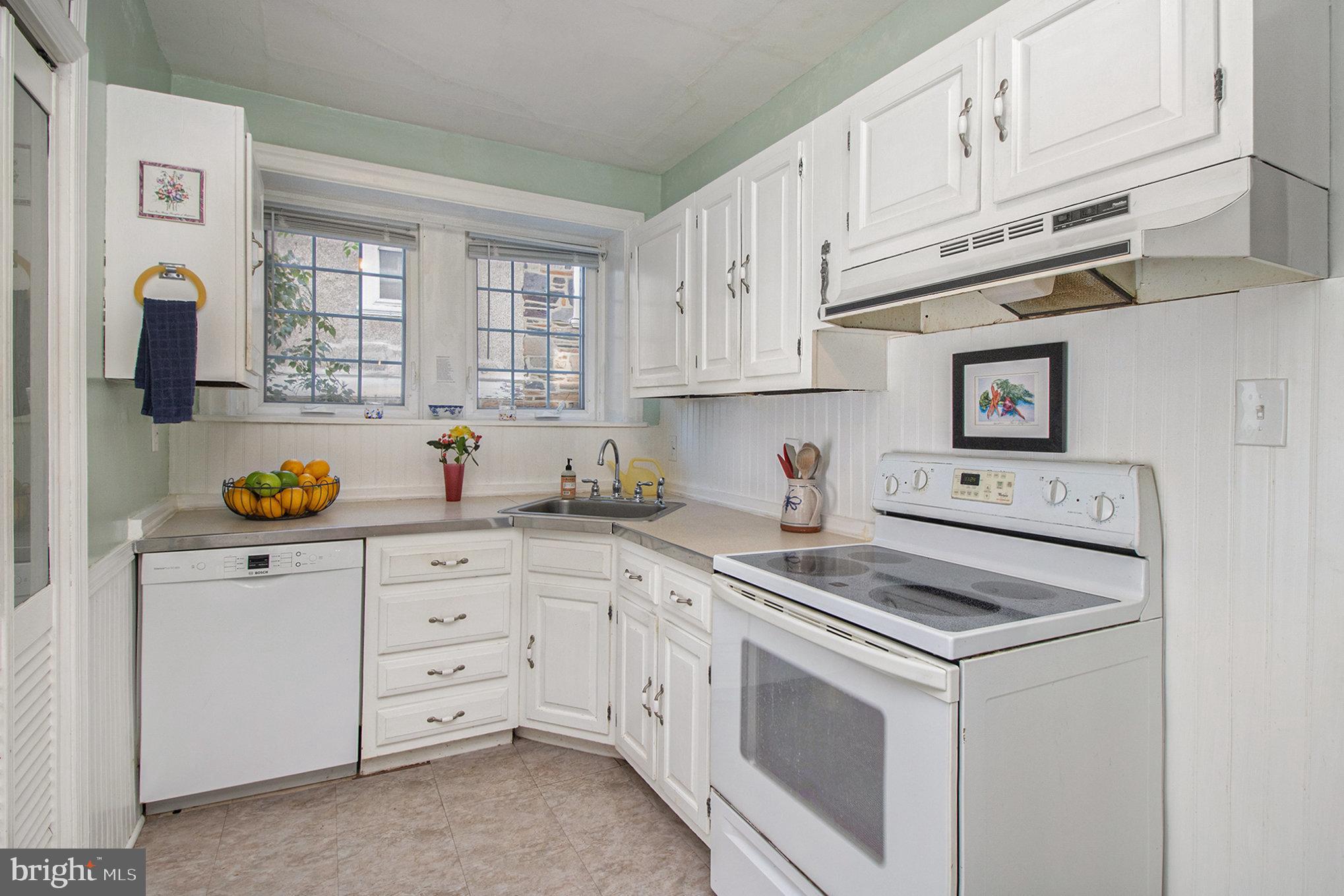 7115 Llanfair Road Upper Darby, PA 19082 - Photo 10 of 49 All white kitchen cabinets and appliances.