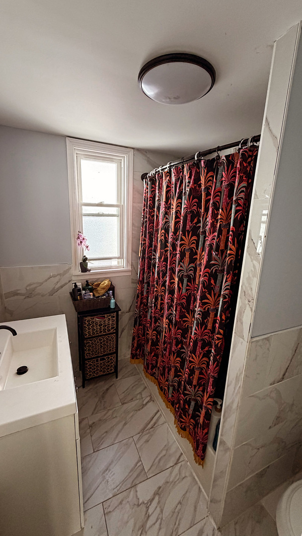 10529 South Perry Avenue Chicago, IL 60628 - Photo 11 of 17 a room with furniture and window