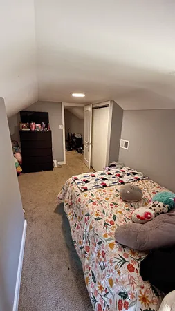a room with a table and a fan