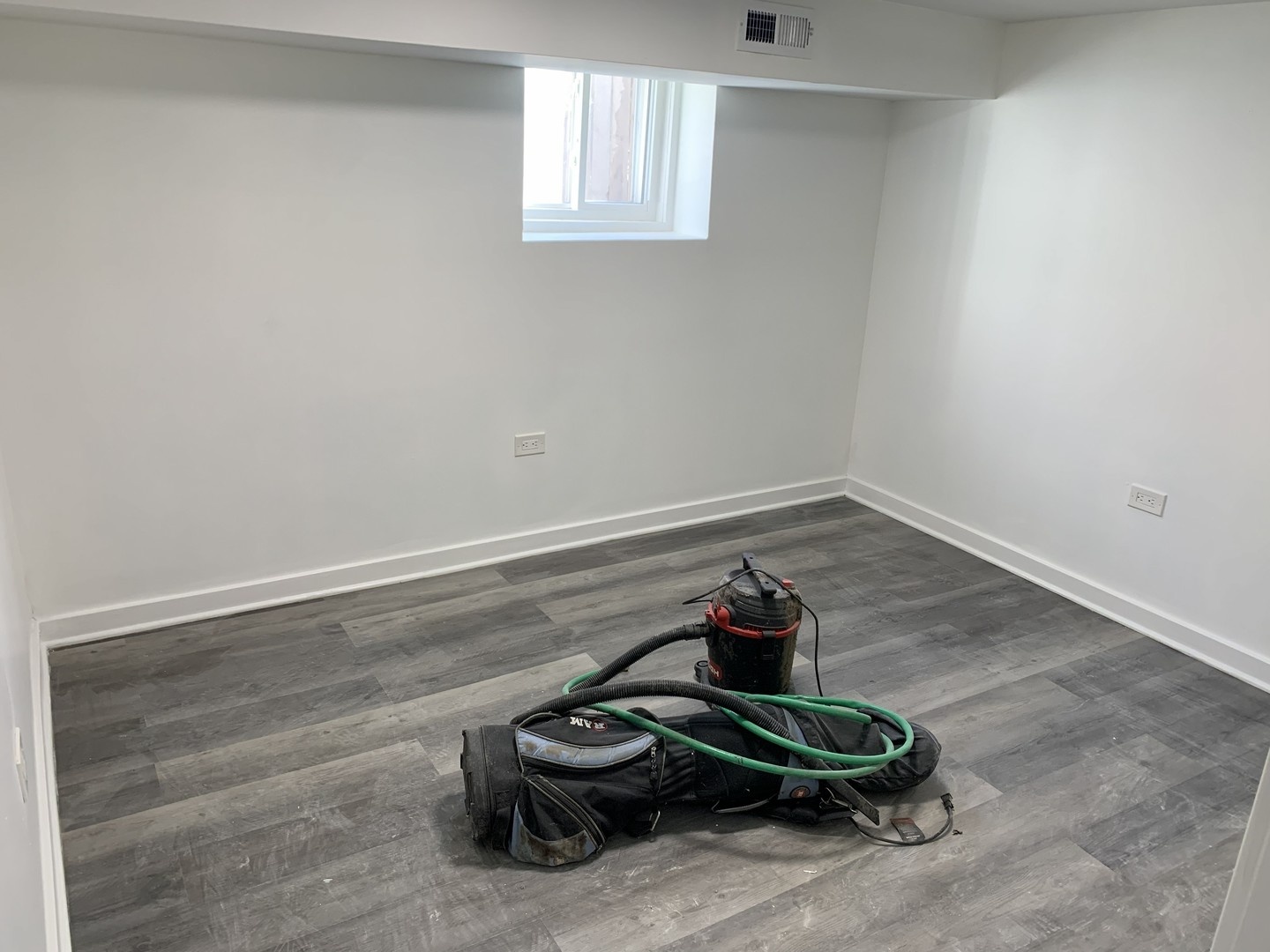 10529 South Perry Avenue Chicago, IL 60628 - Photo 17 of 17 a room with a table and a fan