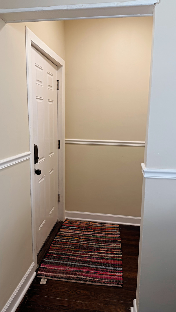 10529 South Perry Avenue Chicago, IL 60628 - Photo 2 of 17 a view of small space with racks on the wall