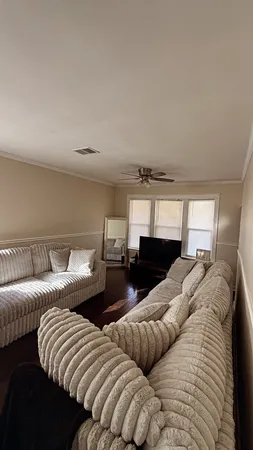 a bedroom with two beds and painting