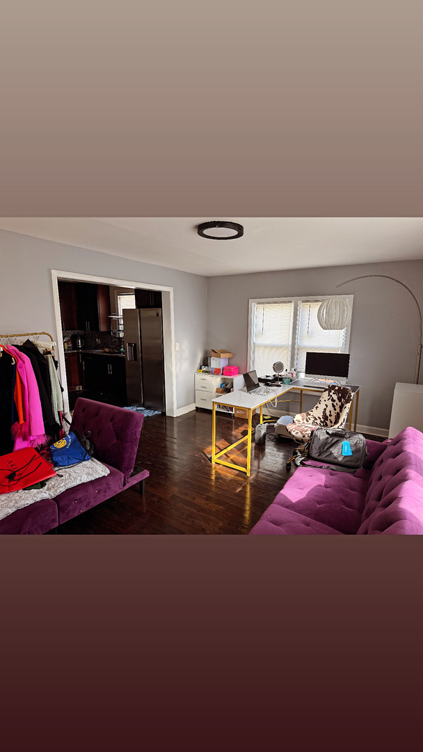 10529 South Perry Avenue Chicago, IL 60628 - Photo 9 of 17 a living room with furniture gym equipment and view of kitchen