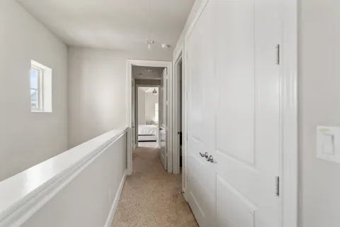 a bedroom with a bed couch and window