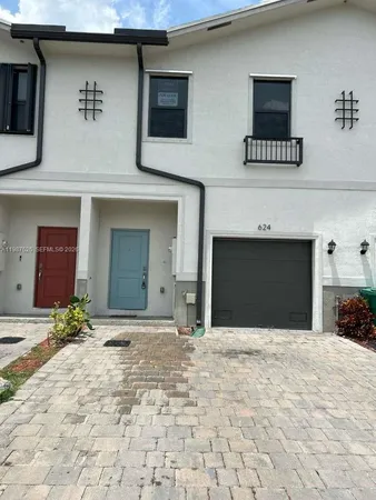 a view of a house with a garage