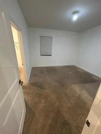 a kitchen with stainless steel appliances a refrigerator sink and cabinets