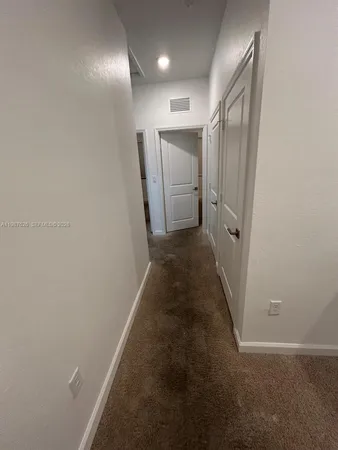 a bathroom with a double vanity sink toilet and shower