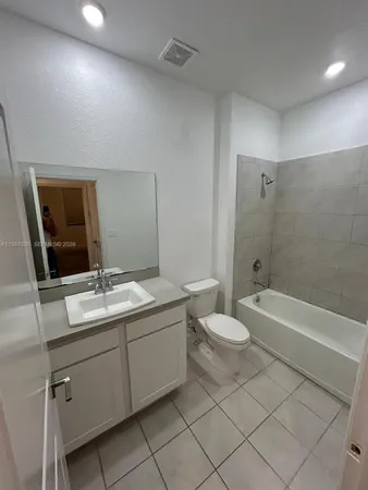 an empty room with a empty space and window