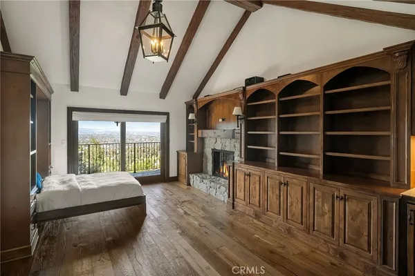 a view of a bedroom with furniture and window