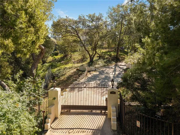 a view of balcony with wooden floor and fence
