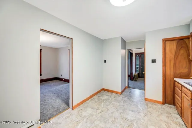 a bathroom with double vanity sink a mirror and a bathtub