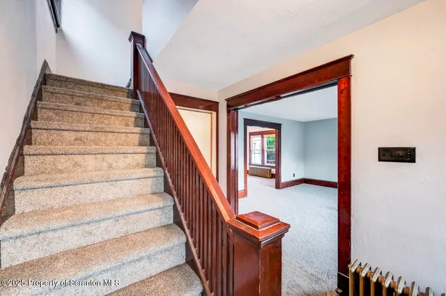 a view of front door with a mirror