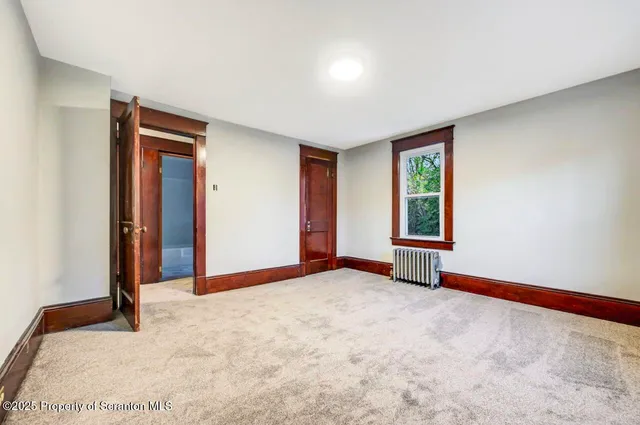 a bath room with a sink a toilet and a bath tub