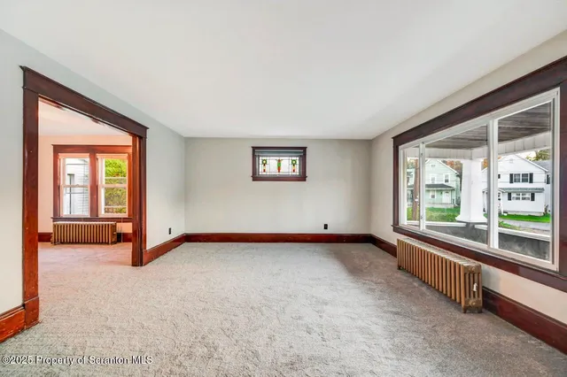 a view of an empty room and window