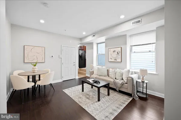 a living room with furniture and a table