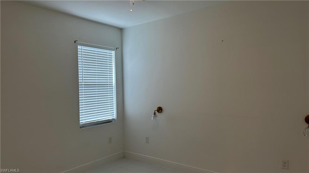 5901 Rita Avenue North Lehigh Acres, FL 33971 - Photo 15 of 22 a view of a room that has a window in it