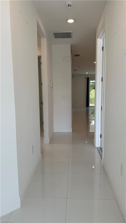 5901 Rita Avenue North Lehigh Acres, FL 33971 - Photo 21 of 22 an empty room with an entrance to other room