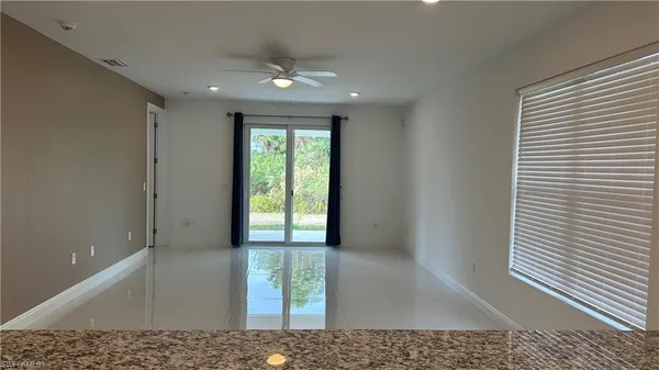 a view of an empty room and window