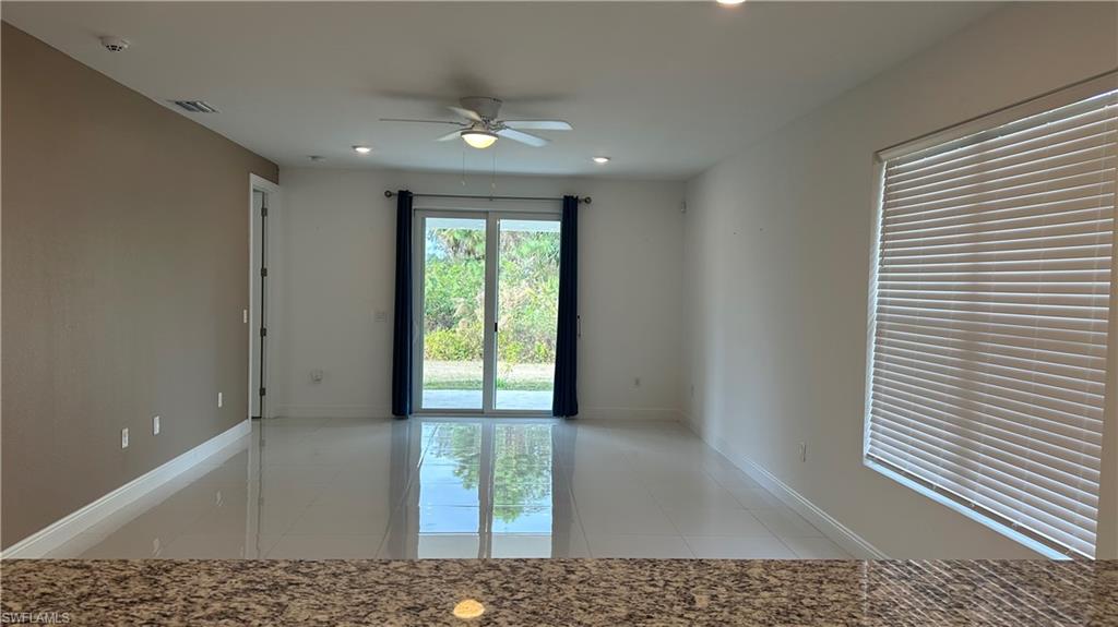 5901 Rita Avenue North Lehigh Acres, FL 33971 - Photo 3 of 22 a view of an empty room and window