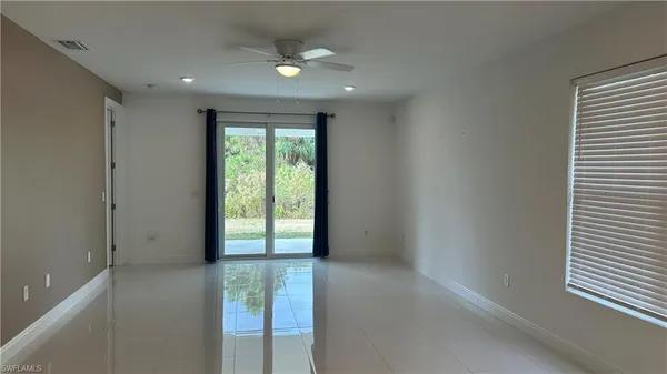 a view of an empty room with a window