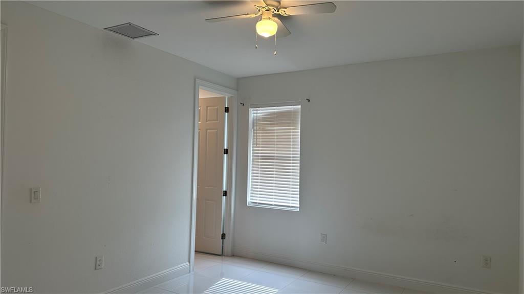 5901 Rita Avenue North Lehigh Acres, FL 33971 - Photo 9 of 22 a view of an empty room with a window