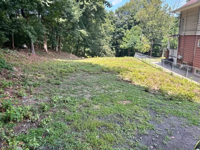 a view of swimming pool with a yard