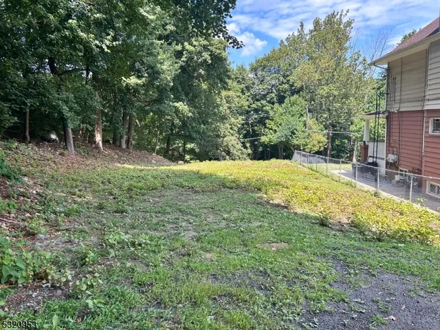 a view of swimming pool with a yard