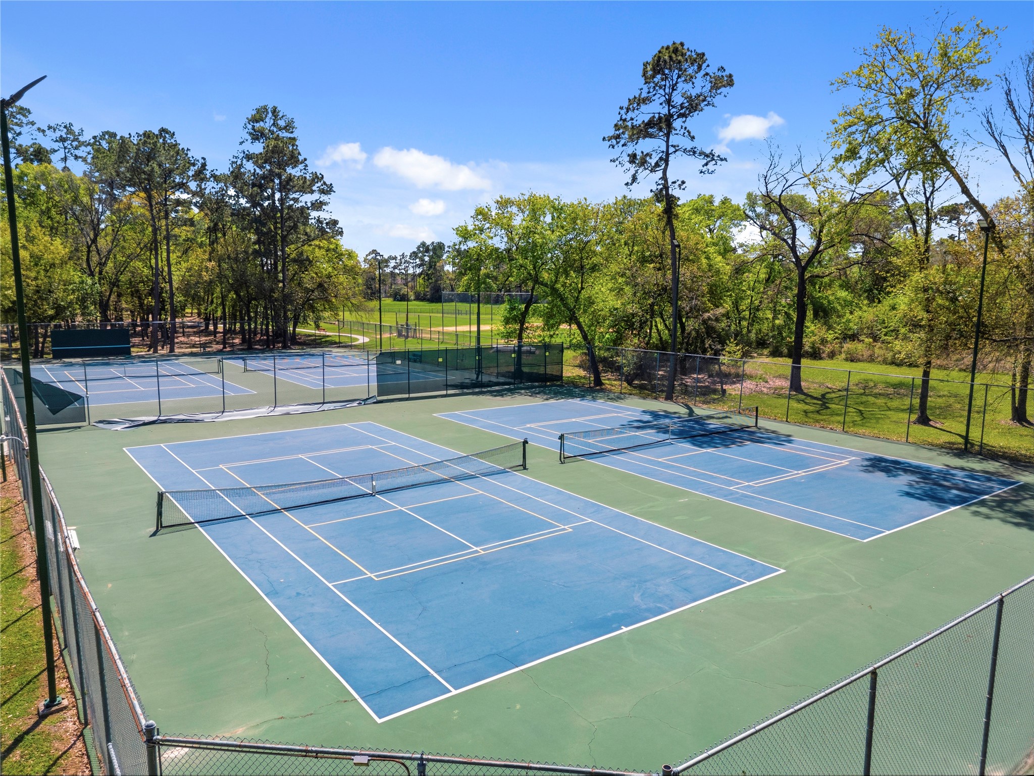 102 Enchanted Oaks Court Spring, TX 77388 - Photo 40 of 48 Here you see the tennis/pickleball courts! There is also a clubhouse that can be rented for private events.