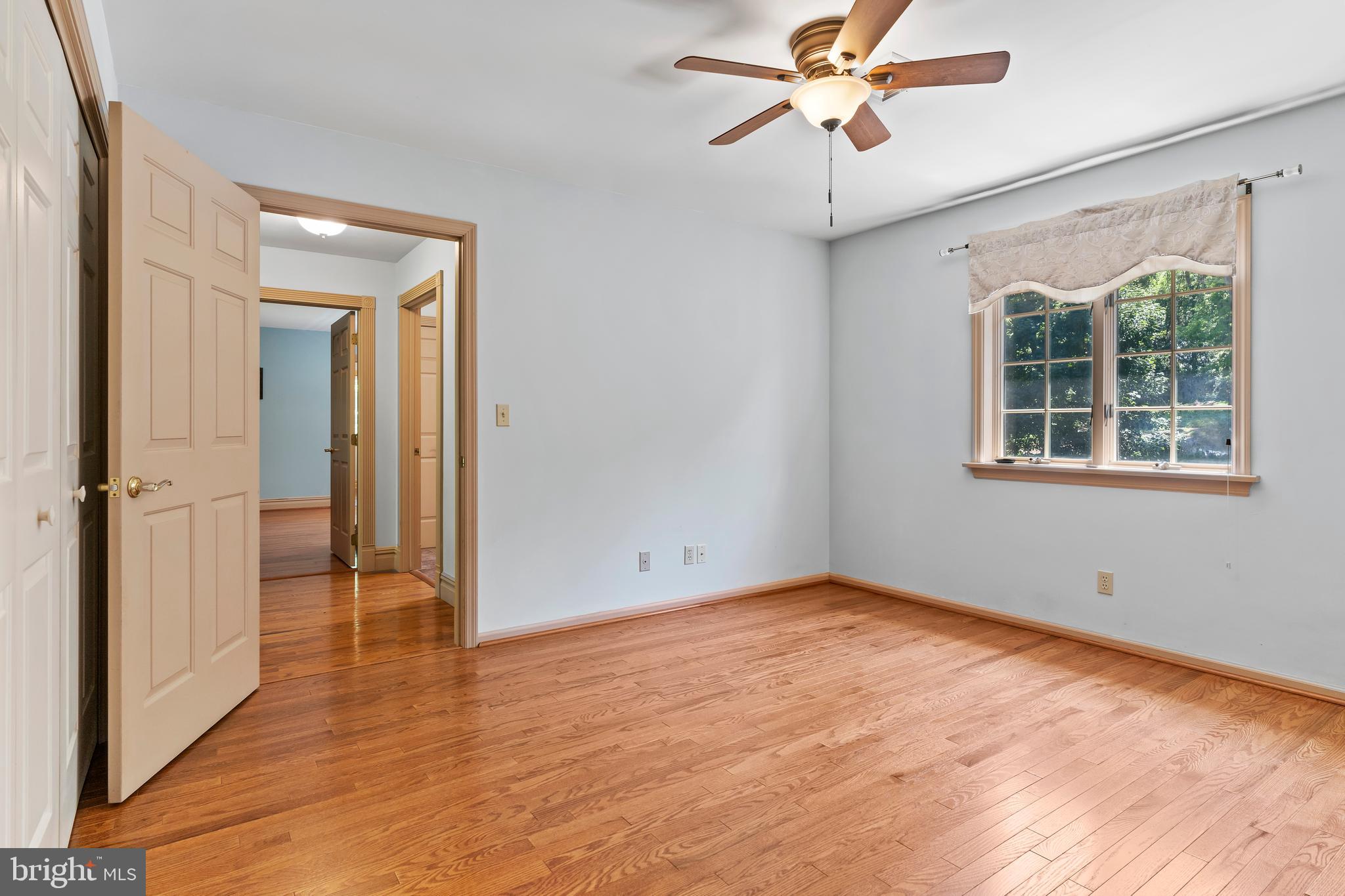 176 Richland Road Carlisle, PA 17015 - Photo 32 of 59 a view of an empty room with a window and wooden floor