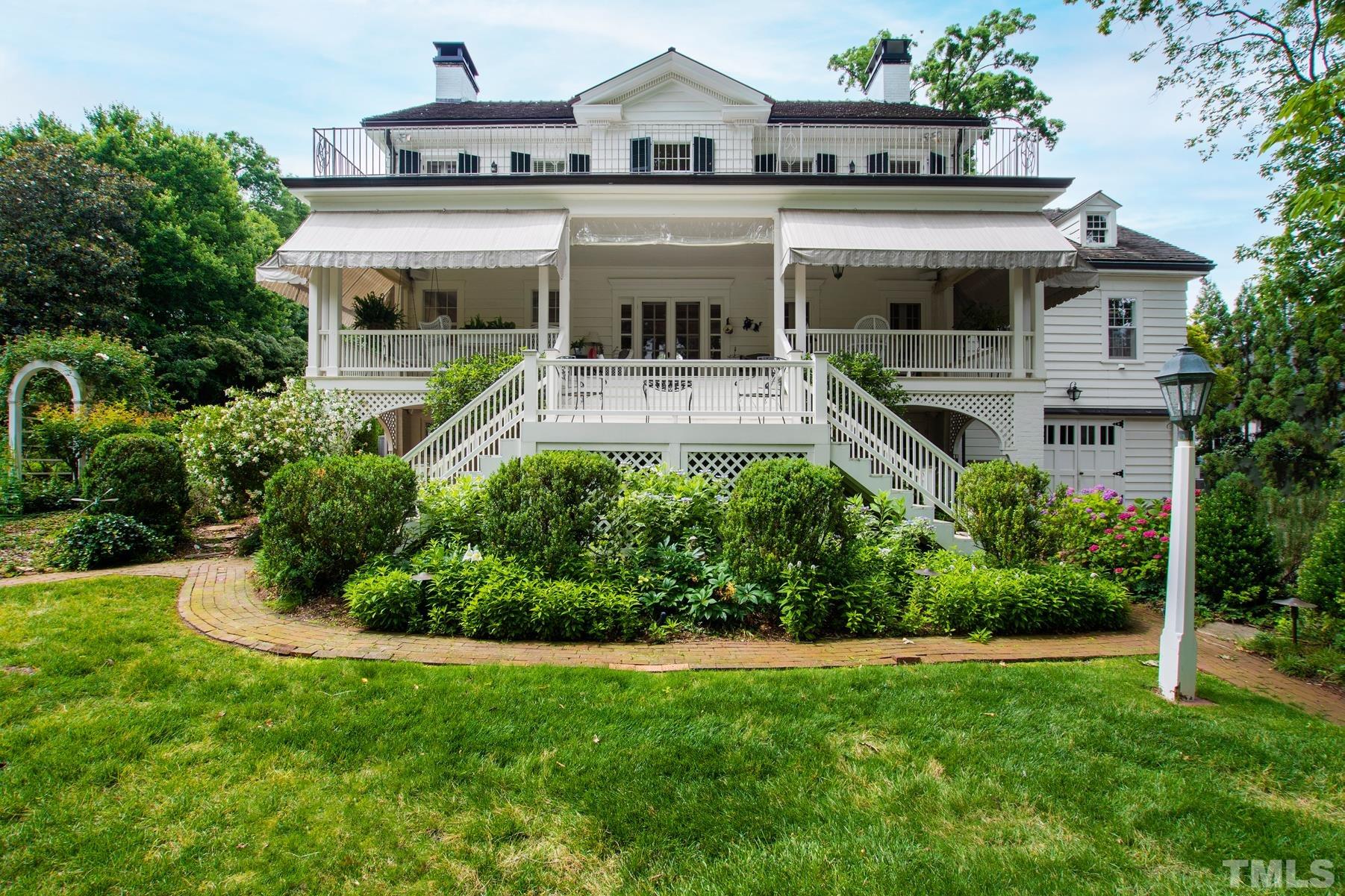 1520 Jarvis Street Raleigh, NC 27608 - Photo 54 of 61 a front view of a house with a yard
