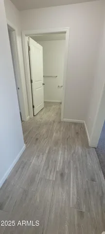 an empty room with an entrance door