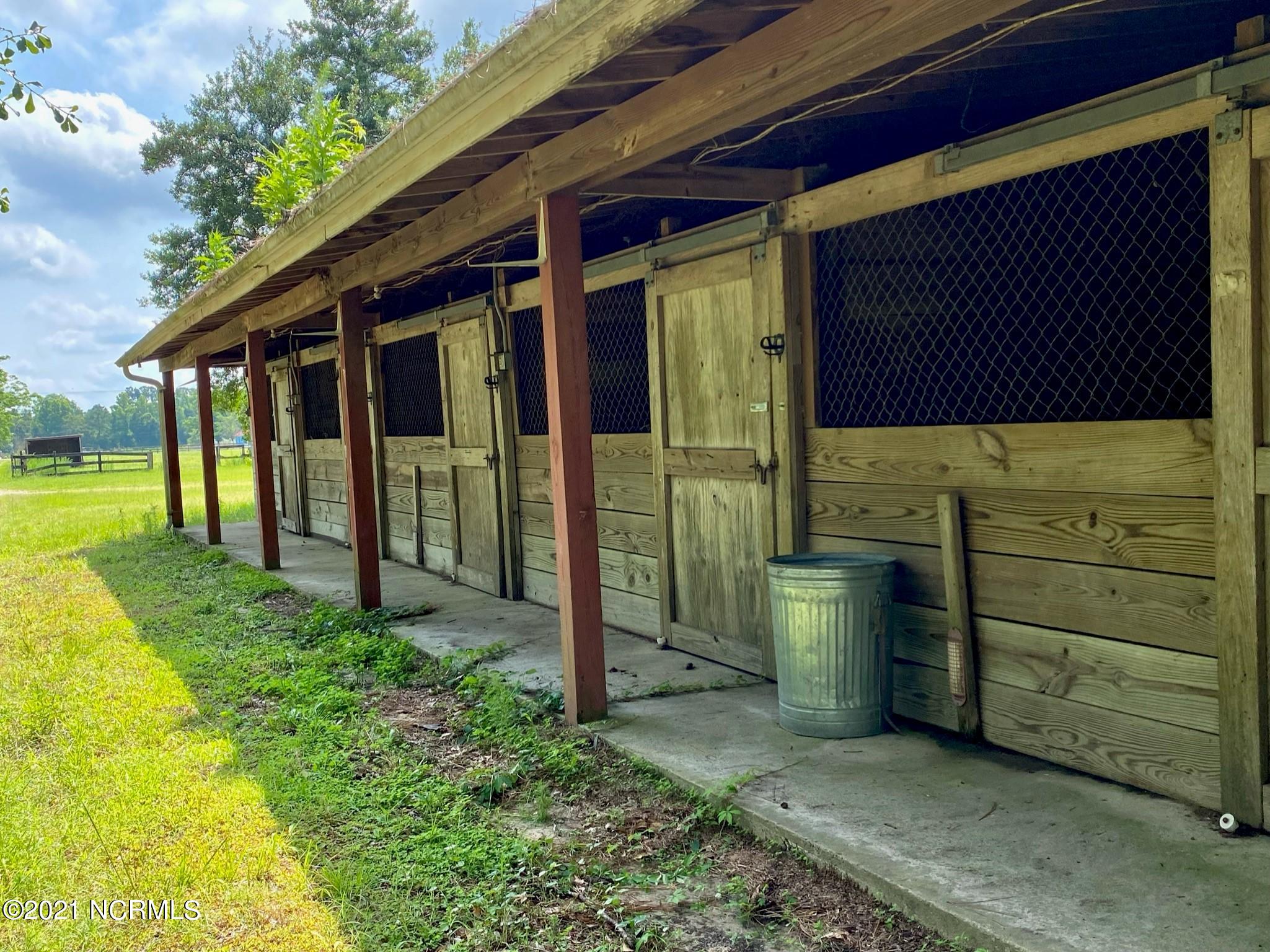 970 Moore Town Road Rocky Point, NC 28457 - Photo 14 of 32 barn outside stalls