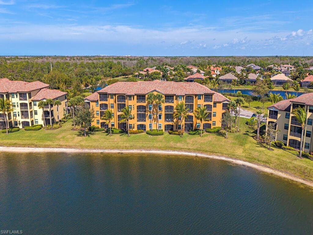 9731 Acqua Court, Unit 514 Naples, FL 34113 - Photo 21 of 21 Drone / aerial view of a nearby body of water and apartment complex / building