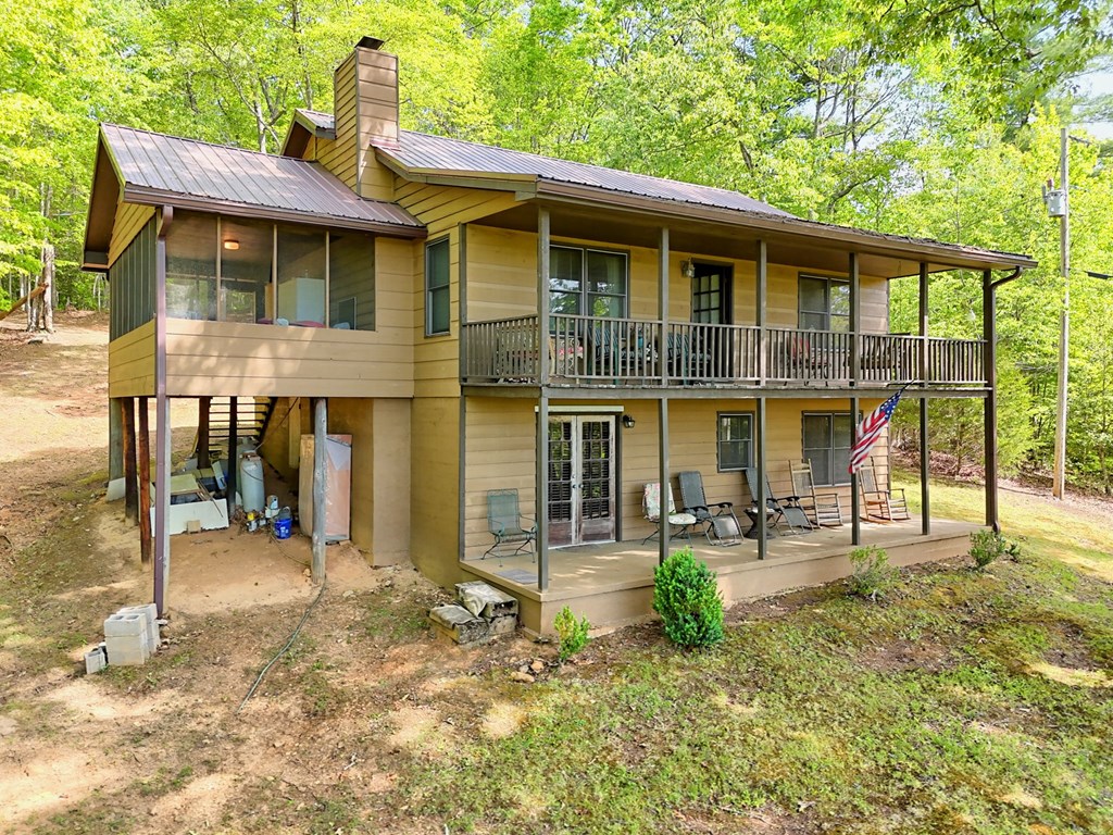 3235 Hiwassee Dam Access Road Murphy, NC 28906 - Photo 18 of 45 a view of a house with backyard porch and sitting area