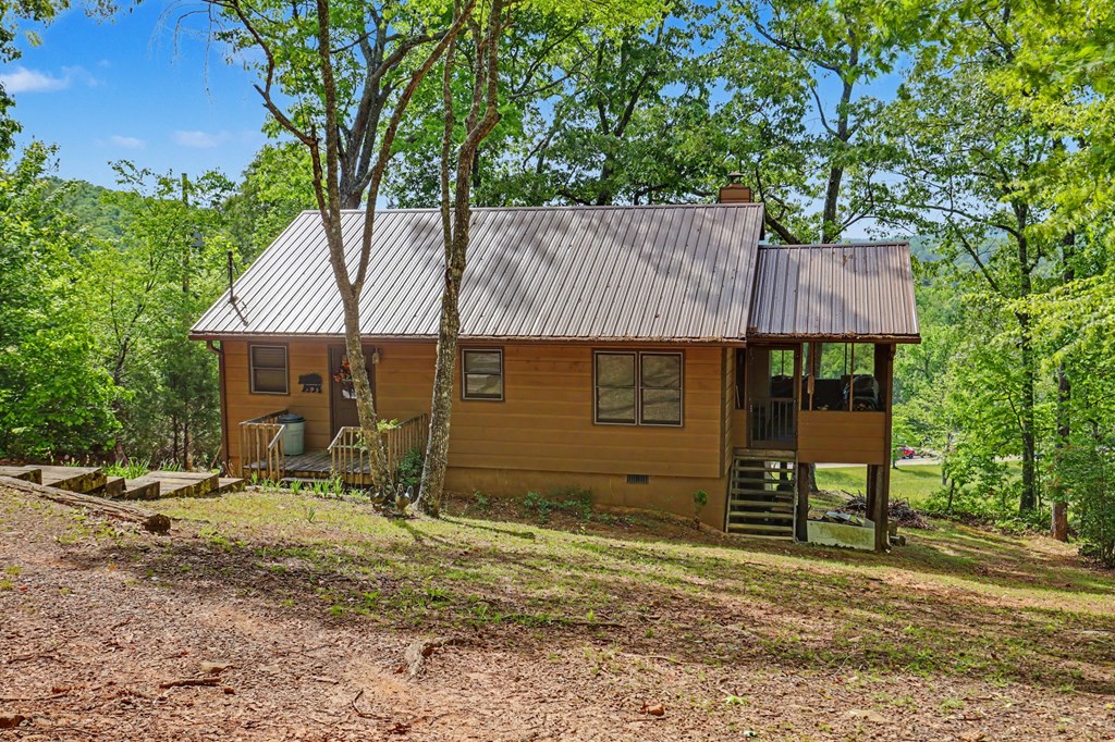 3235 Hiwassee Dam Access Road Murphy, NC 28906 - Photo 19 of 45 a view of a house with a yard and large tree