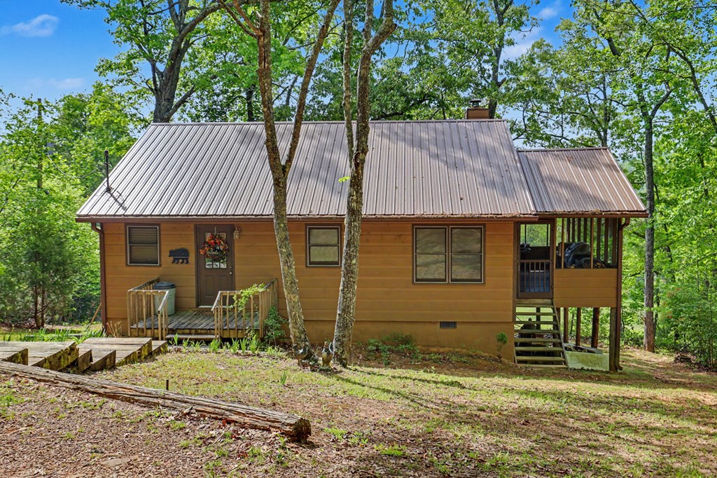 3235 Hiwassee Dam Access Road Murphy, NC 28906 - Photo 20 of 45 a front view of a house with garden